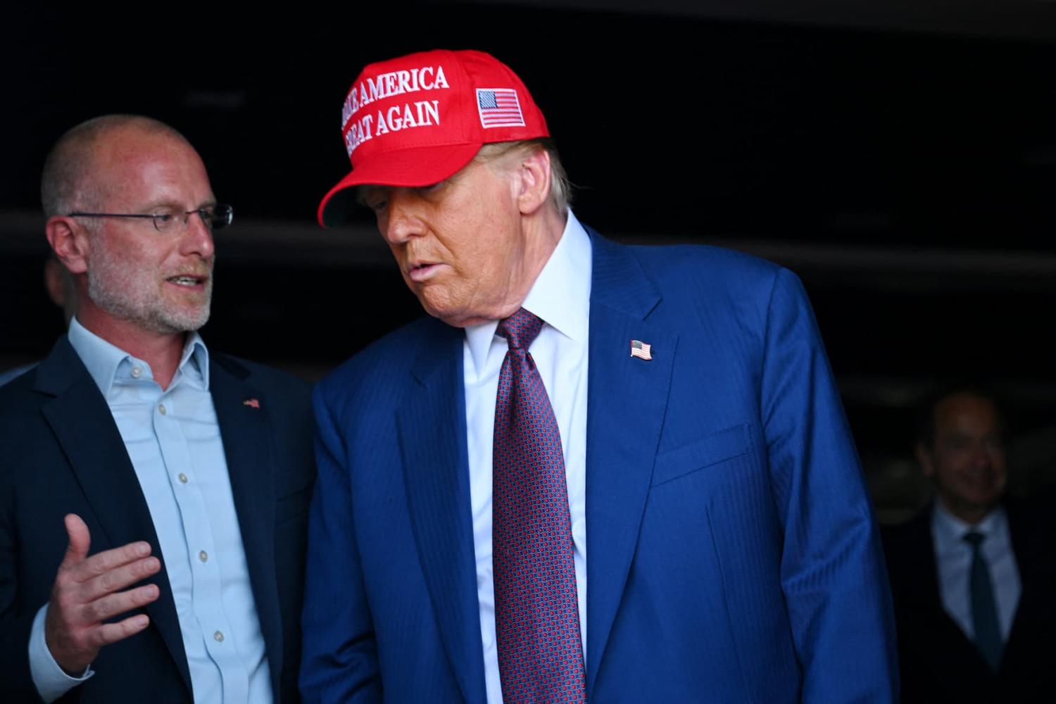 U.S. President-elect Donald Trump speaks to Brendan Carr, his intended pick for Chairman of the Federal Communications Commission, as he attends a viewing of the launch of the sixth test flight of the SpaceX Starship rocket, in Brownsville, Texas, U.S., November 19, 2024.