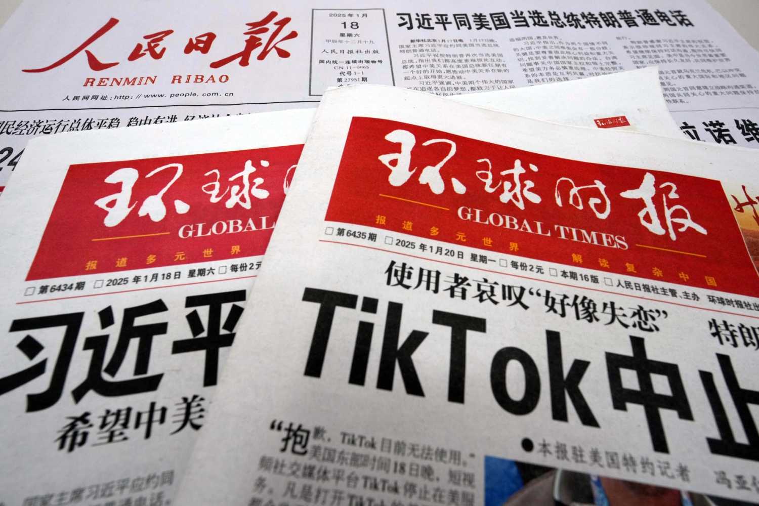 Major Communist Party newspapers in China report on its front page articles related to U.S.-China relations, including the telephone talks between Chinese President Xi Jinping and U.S. President-elect Trump, and the temporary suspension of TikTok services in the U.S., in Beijing, China, January 20, 2025.