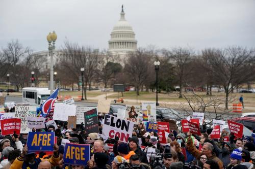 Demonstrators rally during a protest against U.S. President Donald Trump and the actions he has taken in the first weeks of his presidency, outside of the Department of Labor (not pictured) in Washington, U.S., February 5, 2025.
