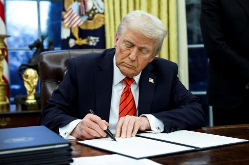 U.S. President Donald Trump signs an executive order in the Oval Office of the White House in Washington