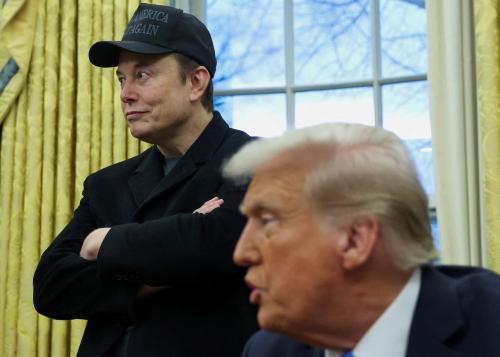 FILE PHOTO: Elon Musk listens to U.S. President Donald Trump speak in the Oval Office of the White House in Washington, D.C., U.S., February 11, 2025.