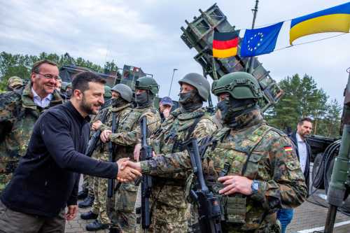 Ukrainian President Volodymyr Zelenskyy interacts with soldiers during his visit to a military training area to find out about the training of Ukrainian soldiers on the Patriot anti-aircraft missile system, at an undisclosed location, in Germany, June 11, 2024.