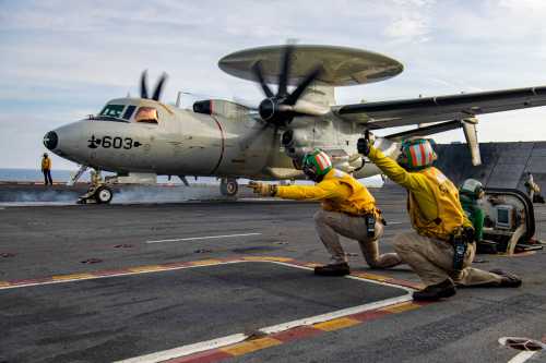 An E-2C Hawkeye from the "Sun Kings" of Carrier Airborne Early Warning Squadron (VAW) 116 launches from the flight deck of the aircraft carrier USS Nimitz (CVN 68).