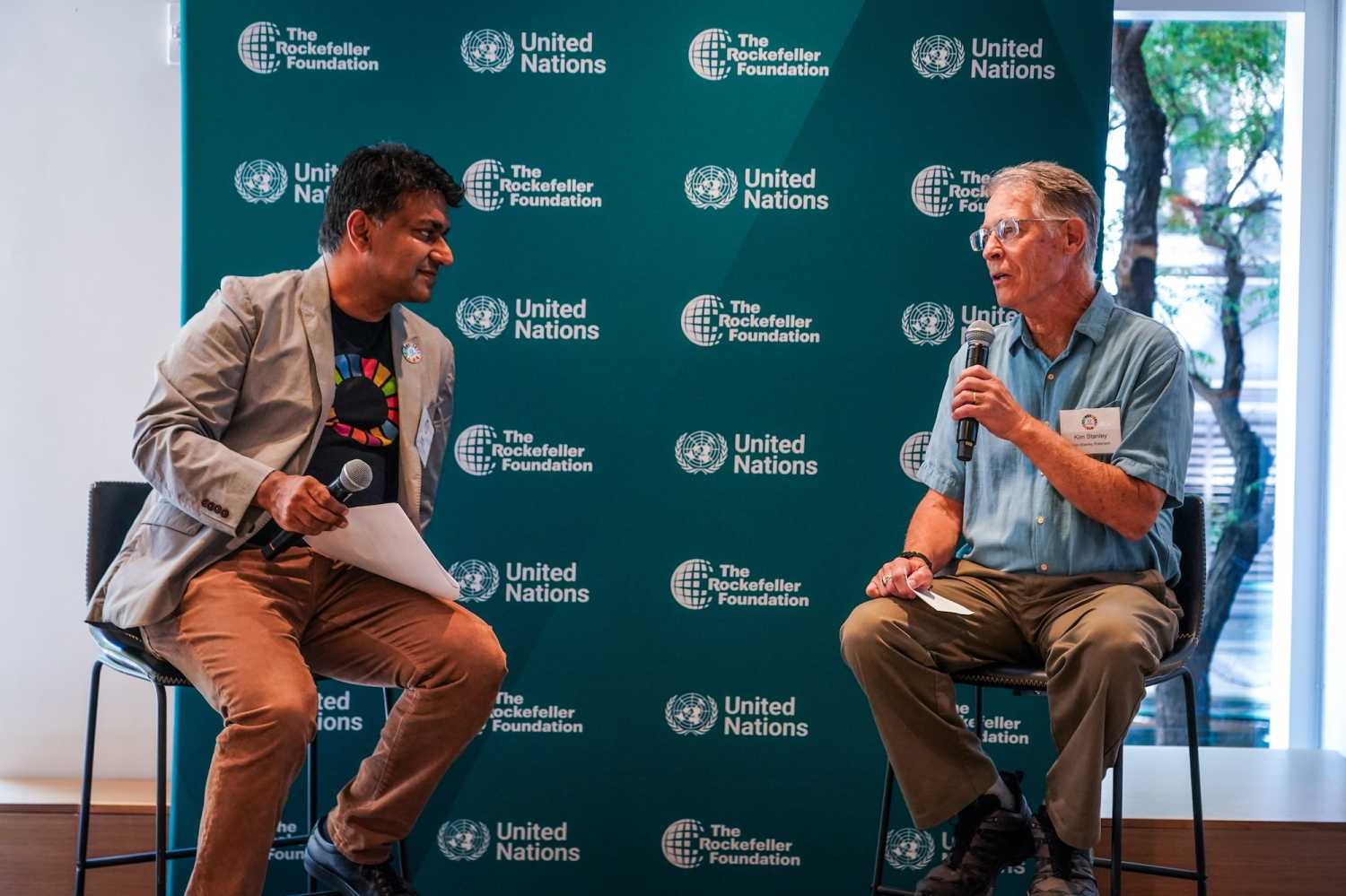 17 Rooms co-chair Zia Khan (left) and 2024 Room 15 member Kim Stanley Robinson (right) in a Q&A conversation on “What fiction teaches us about big ideas” during the September 2024 17 Rooms community gathering on the eve of the U.N. General Assembly.
