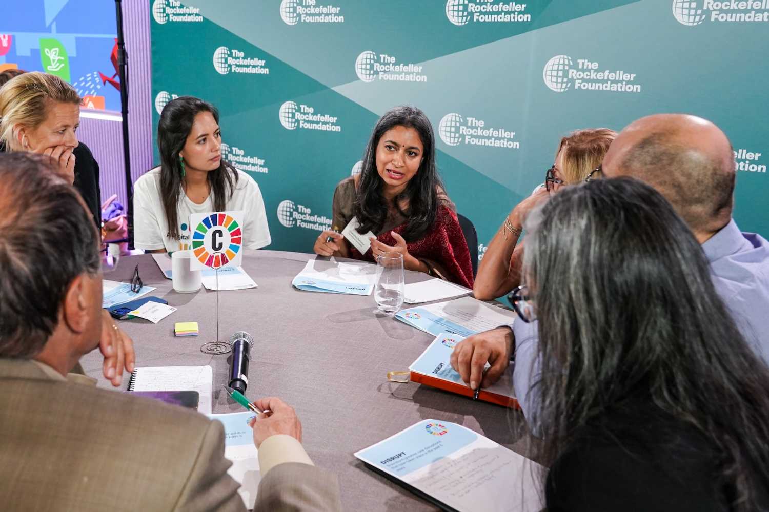 17 Rooms participants, including (left to right) Mabel van Oranje, Aura Cifuentes, and Chandrika Bahadur engage in small group discussions to brainstorm “big ideas” during the September community gathering.