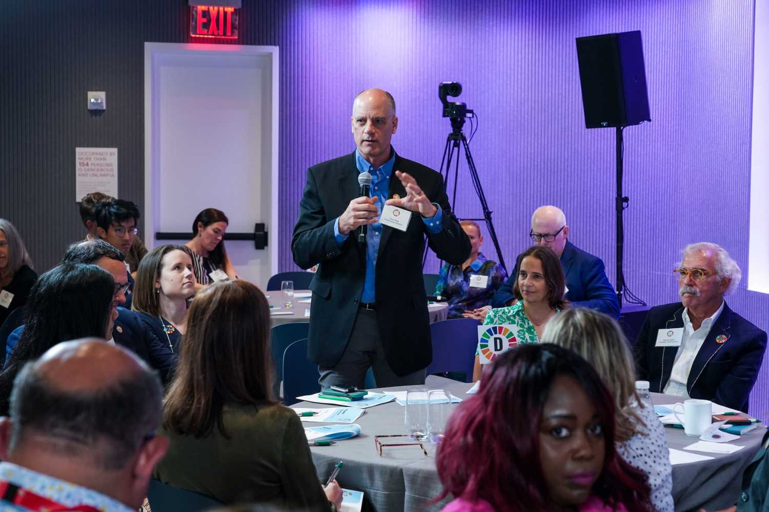 Brookings Senior Fellow Tony Pipa (standing) sharing a rapid report-out on his small group discussion during the September community gathering.