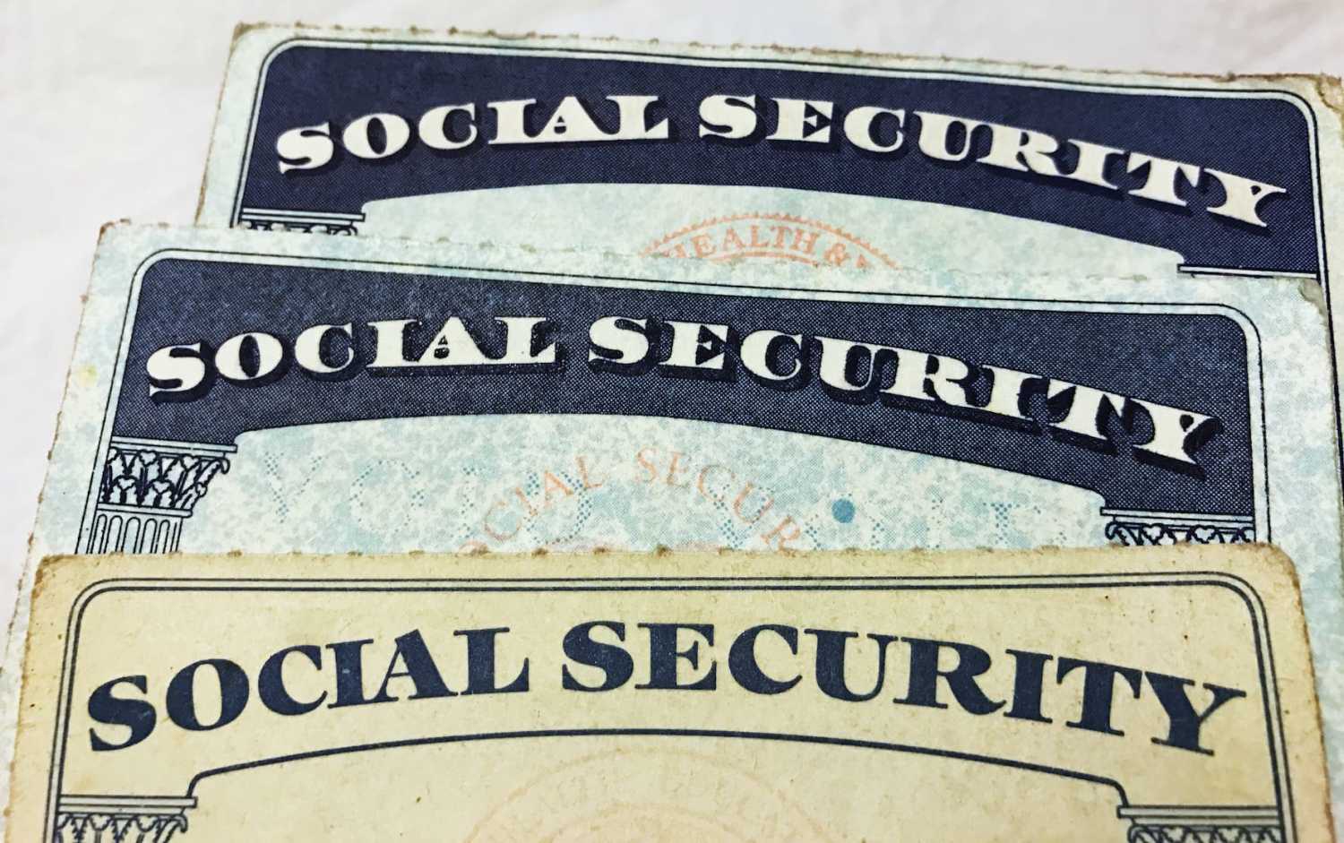 U.S. Social Security card designs over the past several decades are shown in this photo illustration taken on January 7, 2017. REUTERS/Hyungwon Kang