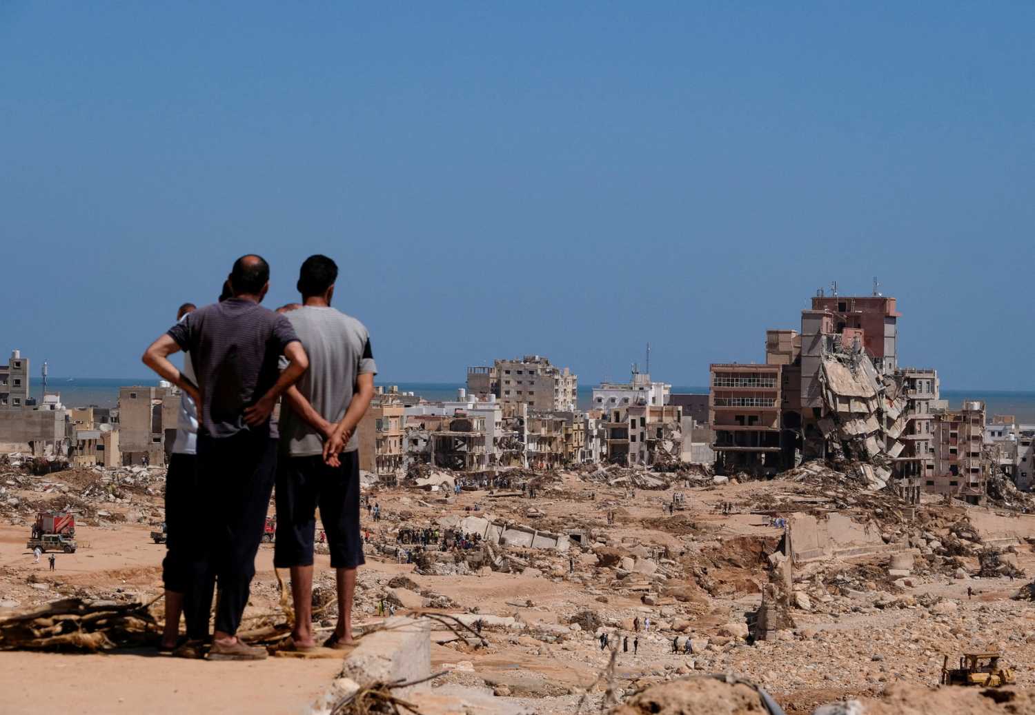 A view shows people looking at the damaged areas in the aftermath of the floods in Derna, Libya September 14, 2023.