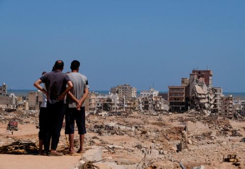 A view shows people looking at the damaged areas in the aftermath of the floods in Derna, Libya September 14, 2023.