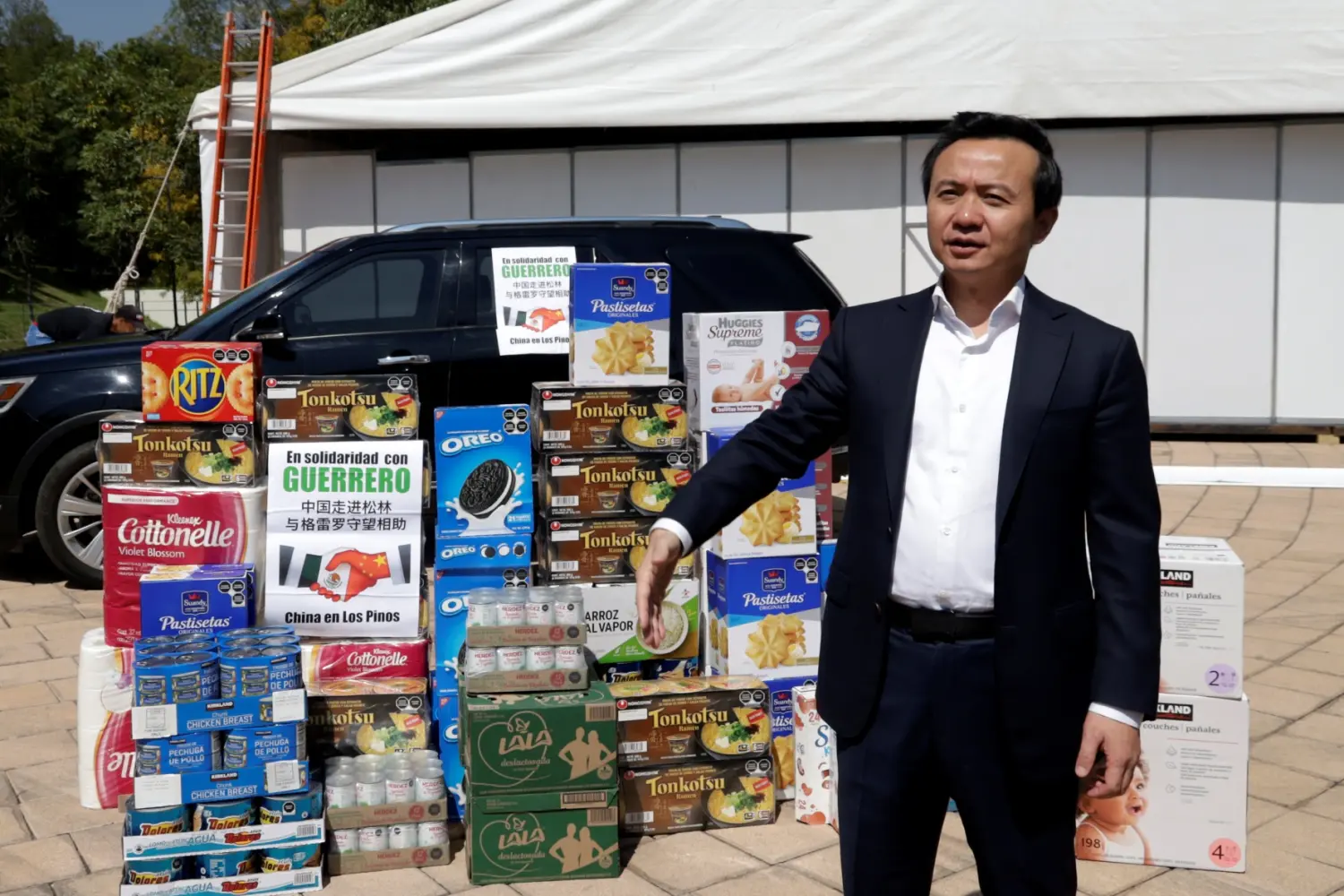 China's ambassador to Mexico, Zhang Run, donates food for those affected by Hurricane Otis in Mexico City on October 25, 2023.