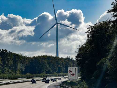 Cars drive by a windmill on a section of the autobahn in Germany in this photo dated September 28, 2024.