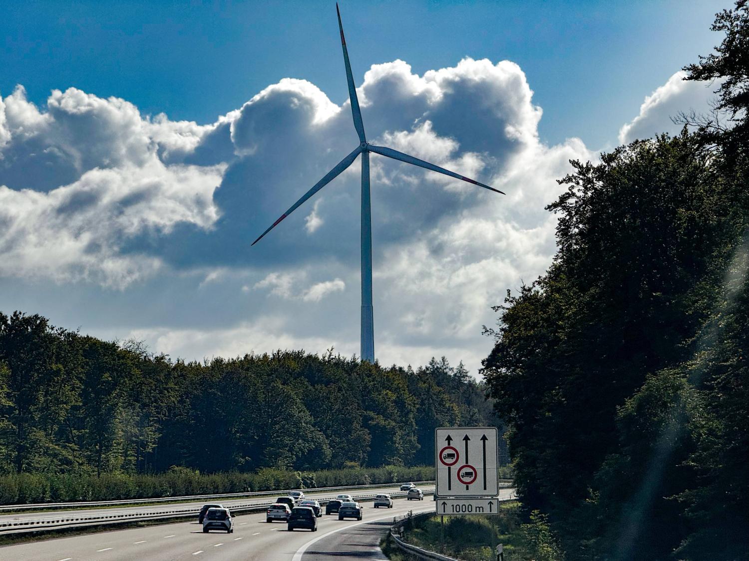 Cars drive by a windmill on a section of the autobahn in Germany in this photo dated September 28, 2024.