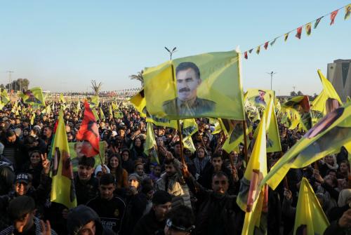 Syrian Kurds gather as they hold flags after Turkey's jailed militant leader Abdullah Ocalan called on his Kurdistan Workers Party (PKK) to lay down its arms on Thursday, a move that could end its 40-year conflict with Ankara and have far-reaching political and security consequences for the region, in Hasakah, Syria February 27, 2025.