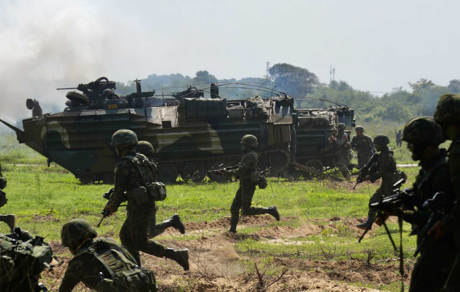 South Korea amphibious assault vehicles fire a smoke screen during the Cobra Gold 2025 joint military exercise at a military base in Sattahip, Chonburi, Thailand, on March 3, 2025. The Cobra Gold exercise is the largest joint multilateral military exercise in Southeast Asia, co-hosted annually in Thailand by the Royal Thai Armed Forces and the U.S. Indo-Pacific Command.