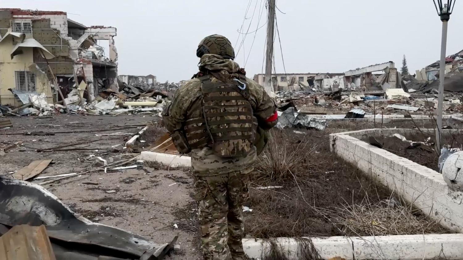 A Russian army soldier walks along a ruined street of Malaya Loknya settlement, which was recently retaken by Russia's armed forces in the course of Russia-Ukraine conflict in the Kursk region, Russia, in this still image taken from video released March 13, 2025.