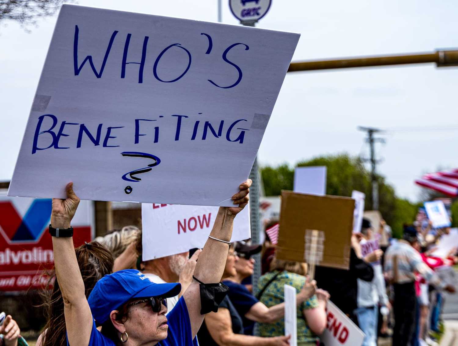 Protesters hold signs and chant slogans outside a Tesla showroom during a demonstration in Richmond, Virginia, USA on March 29, 2025. More than 300 people turned out for the event to protest Elon Musk and his quasi-governmental DOGE group as part of the nationwide Tesla Takedown movement.