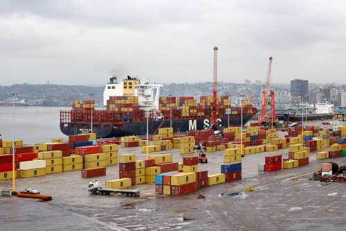 The MSC container ship is docked while a truck drives past containers at the Durban Harbour, in Durban, South Africa, February 7, 2025. REUTERS/Siphiwe Sibeko