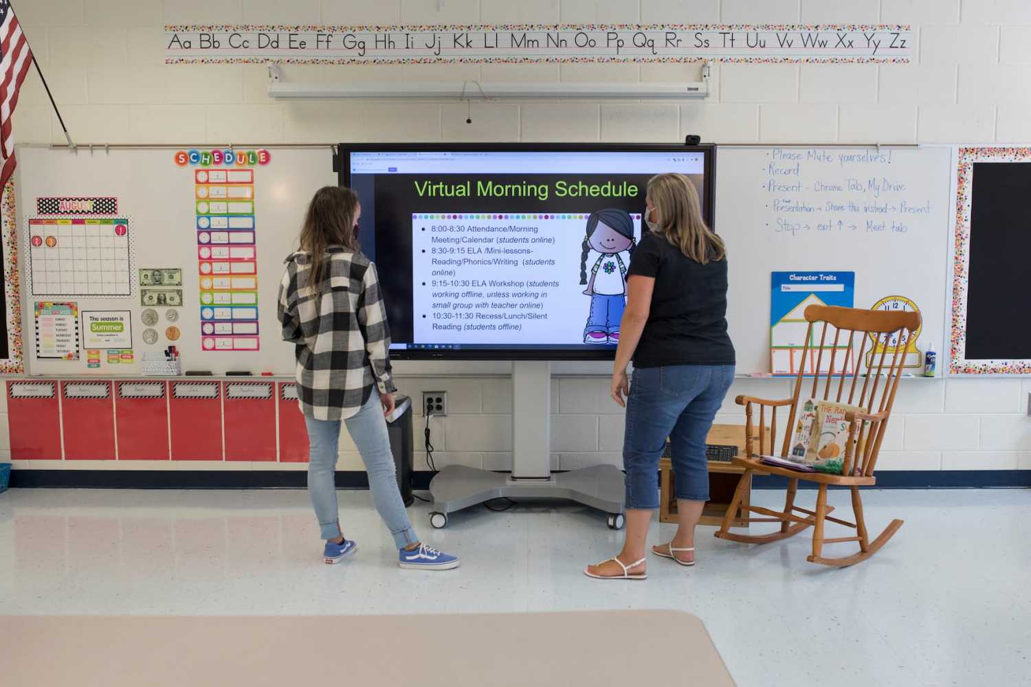 Teachers finalize their virtual open house presentation in advance of the start of the online school year on July 29, 2020.