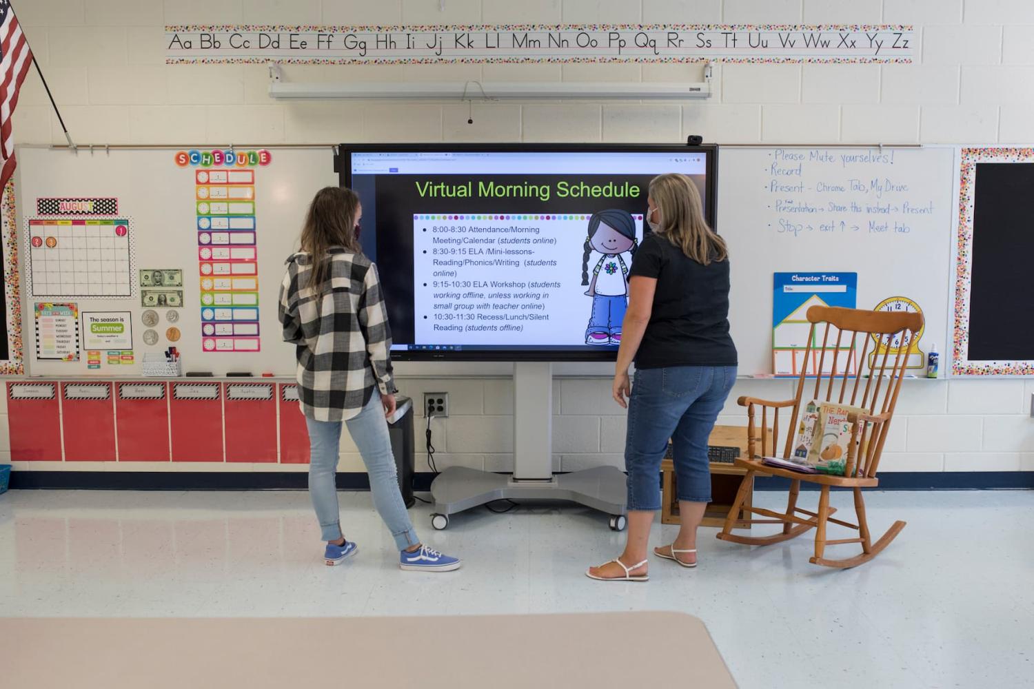 Teachers finalize their virtual open house presentation in advance of the start of the online school year on July 29, 2020.