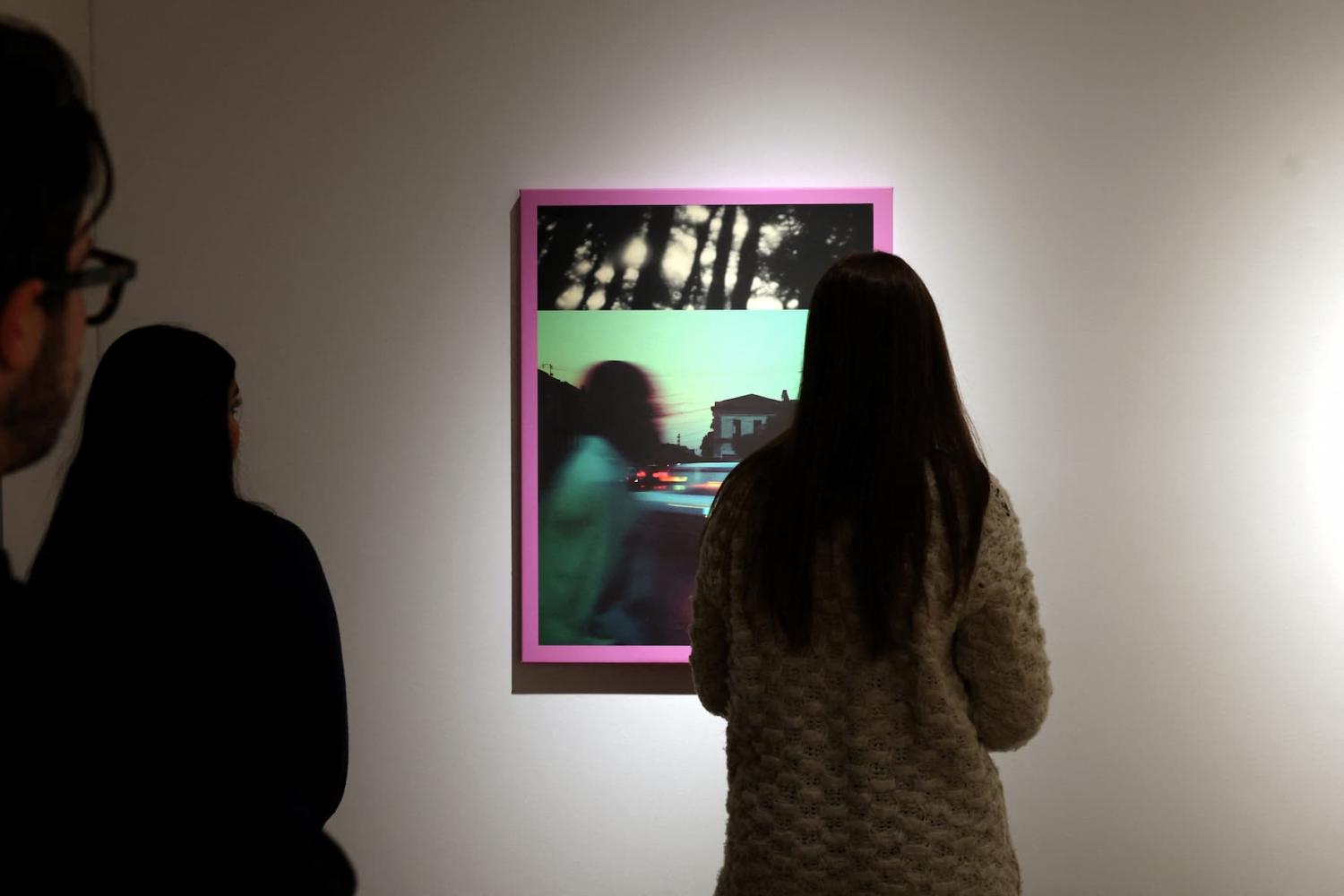 People look at Linda Dounia Rebeiz's 14° 40′ 34.46″ N 17° 26′ 15.14″ W, which is displayed during a preview for a first-ever AI-dedicated art sale at Christie's Auctions in New York City, U.S., February 5, 2025.