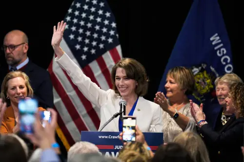 Susan Crawford waves to supporters at watch party after she beat Brad Schimel 54%-46% in a race for an open seat on the court in Madison, Wisconsin on March 30, 2025. The campaign was the most expensive state supreme court race in U.S. history, with expenditures topping in millions. Crawford's victory means that liberals will retain a 4-3 majority on the Wisconsin Supreme Court.