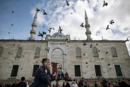 A man walks by a mosque during Eid al-Fitr holiday in Istanbul, Turkey March 31, 2025.