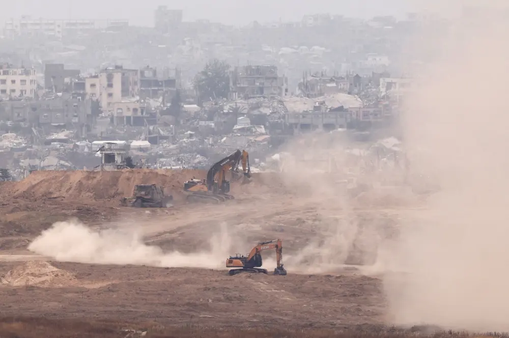 Israeli construction machineries operate inside Gaza, as seen from Israel's side of the border with Gaza, in southern Israel, April 23, 2025.