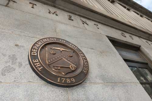 US Treasury Department building, with seal near one entrance