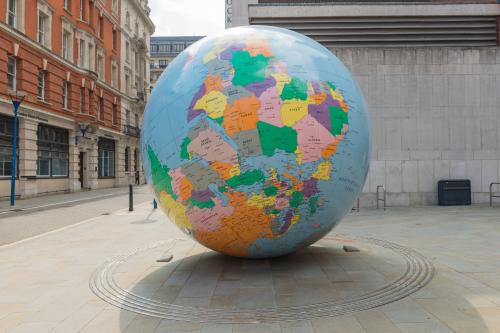 image of a large globe balanced on the Arctic
