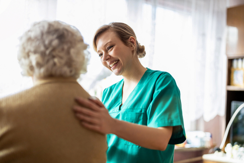 Nurse working with senior patient.