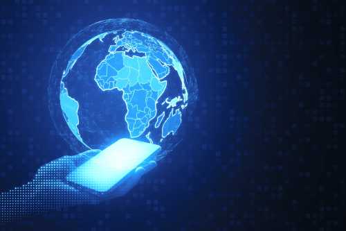 Close up of pixel hands holding mobile phone with digital polygonal globes on blue background. Global network and innovation