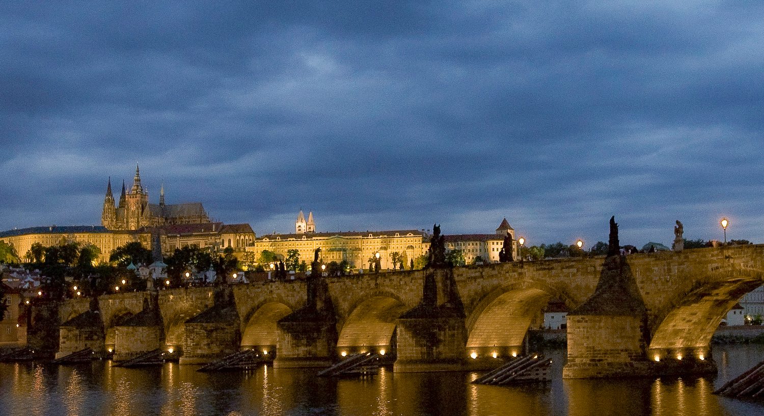A view of Prague's medieval Charles Bridge with Prague Castle in the background on July 9, 2007.