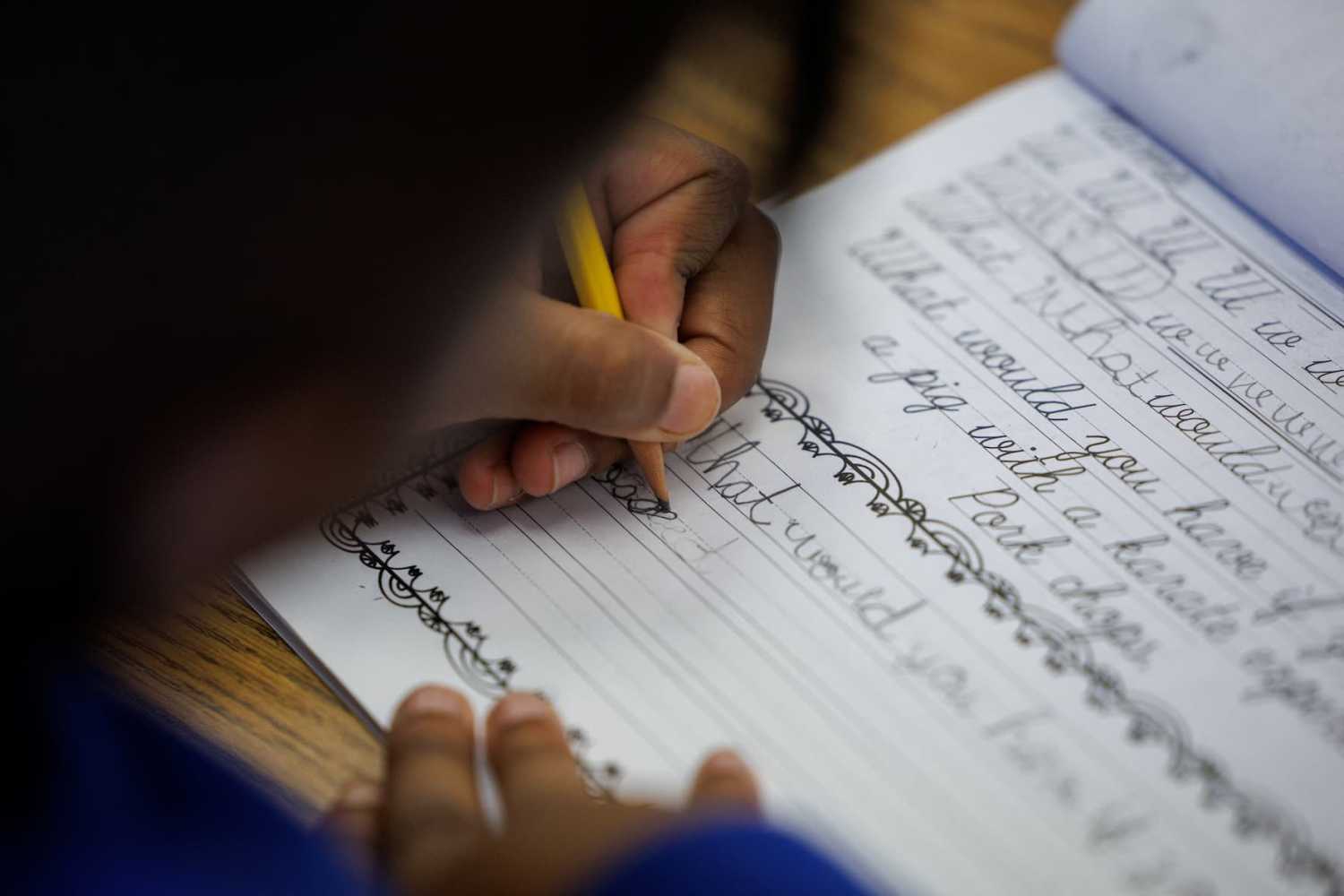 A student at Orangethorpe Elementary School practices writing cursive as California grade school students are being required to learn cursive handwriting this year, in Fullerton, California, U.S., on January 23, 2024.
