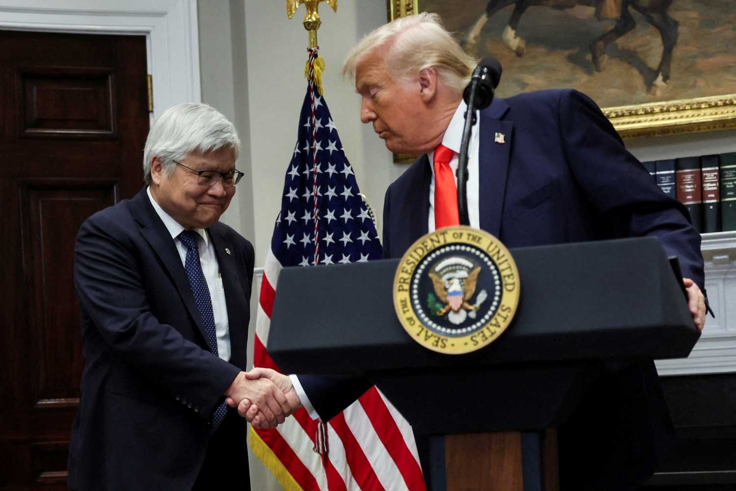 U.S. President Donald Trump shakes hands with C.C. Wei, chairman and CEO of TSMC, as they make an announcement about an investment from Taiwan Semiconductor Manufacturing Company (TSMC), in the Roosevelt Room at the White House in Washington, DC, U.S., March 3, 2025.