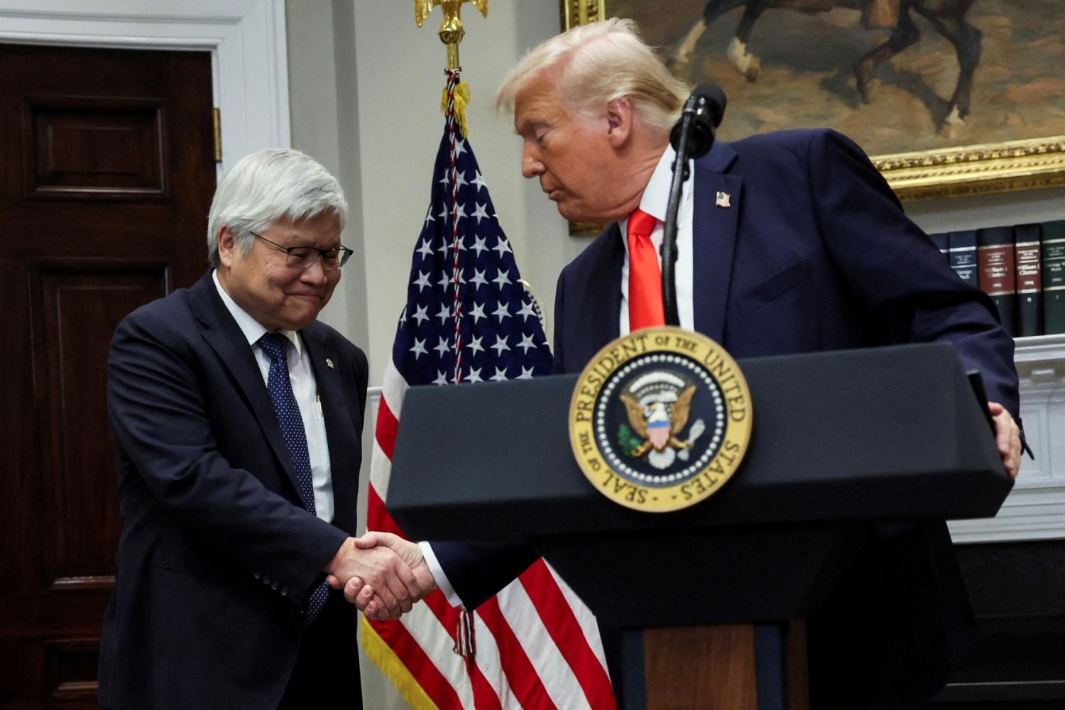 U.S. President Donald Trump shakes hands with C.C. Wei, chairman and CEO of TSMC, as they make an announcement about an investment from Taiwan Semiconductor Manufacturing Company (TSMC), in the Roosevelt Room at the White House in Washington, DC, U.S., March 3, 2025.