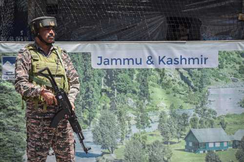 An Indian paramilitary soldier stands guard along a road in Srinagar, Jammu and Kashmir, on April 30, 2025.