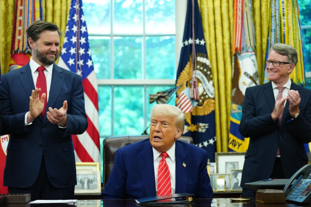 United States President Donald Trump announces a trade agreement between the United States and the United Kingdom in the Oval Office of the White House.