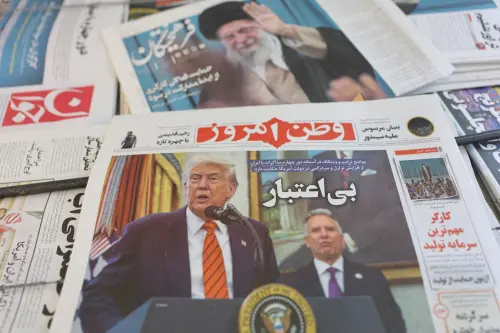 An Iranian newspaper with a cover photo of U.S. President Donald Trump and U.S. Middle East envoy Steve Witkoff, is seen in Tehran May 11, 2025.