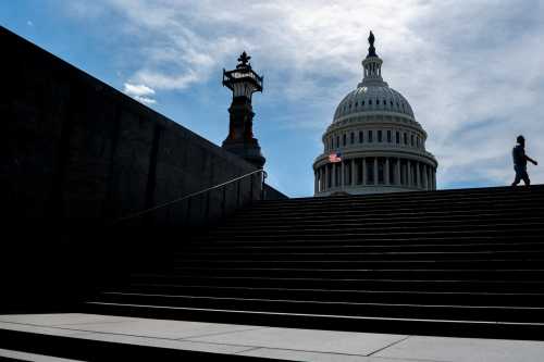 A person walks near the Capitol on in Washington, D.C., U.S., on May 19, 2025.