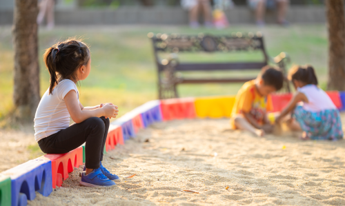 Child being left out representing the low-income families being left out of the Child Tax Credit