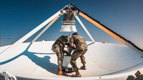U.S. Space Force Guardians assigned to the 42nd Electromagnetic Warfare Combat Detachment swap an antenna feed on top of a large multi-band antenna within the U.S. Central Command area of responsibility, Nov. 25, 2024.