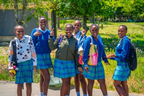School girls smiling in Veyane Cultural Village, Khula, Khula Village, KwaZulu-Natal Province, South Africa.