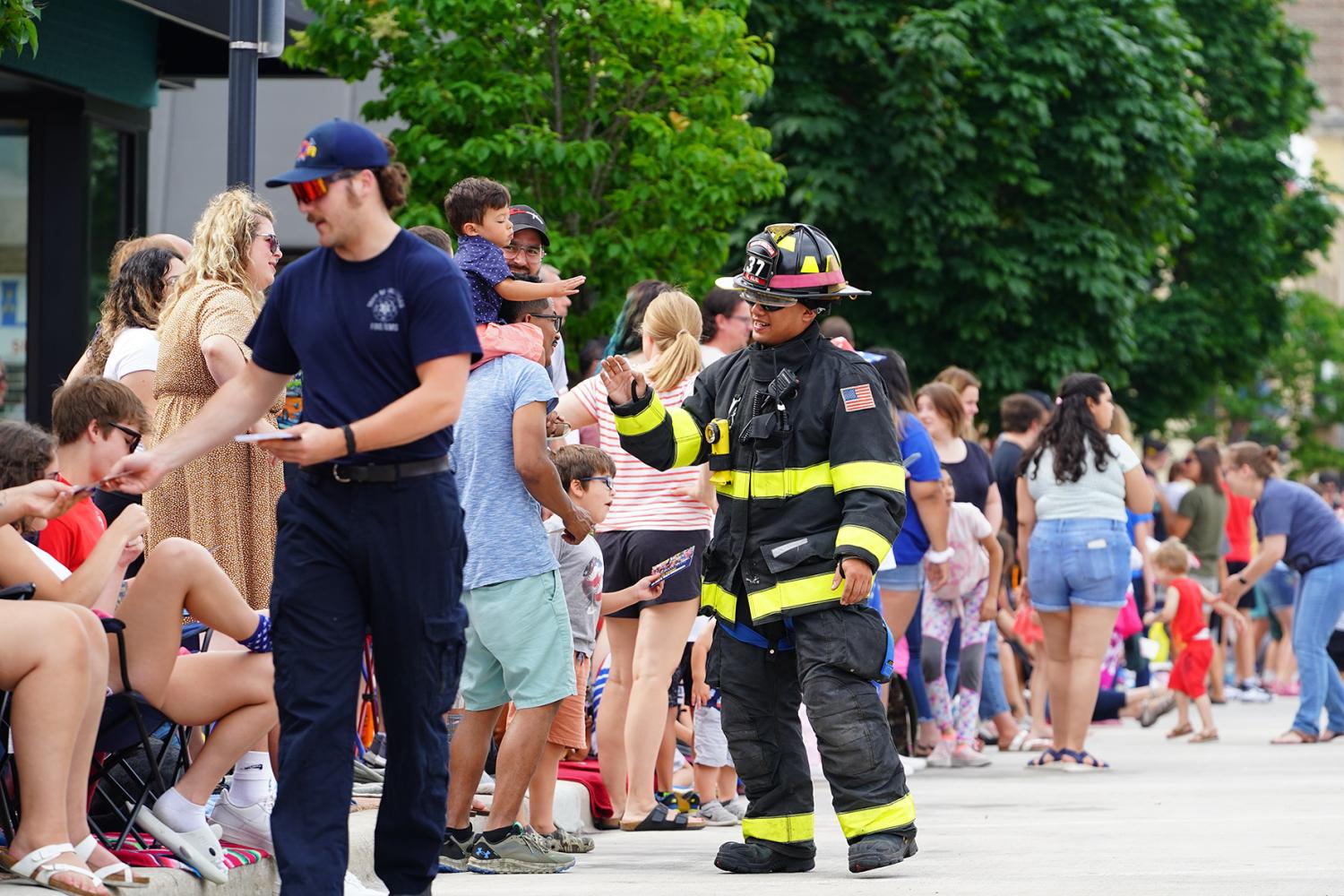 Sheboygan, Wisconsin USA - July 4th, 2022: Community Fire Fighters participated in Freedom Fest parade and interacted with spectators.