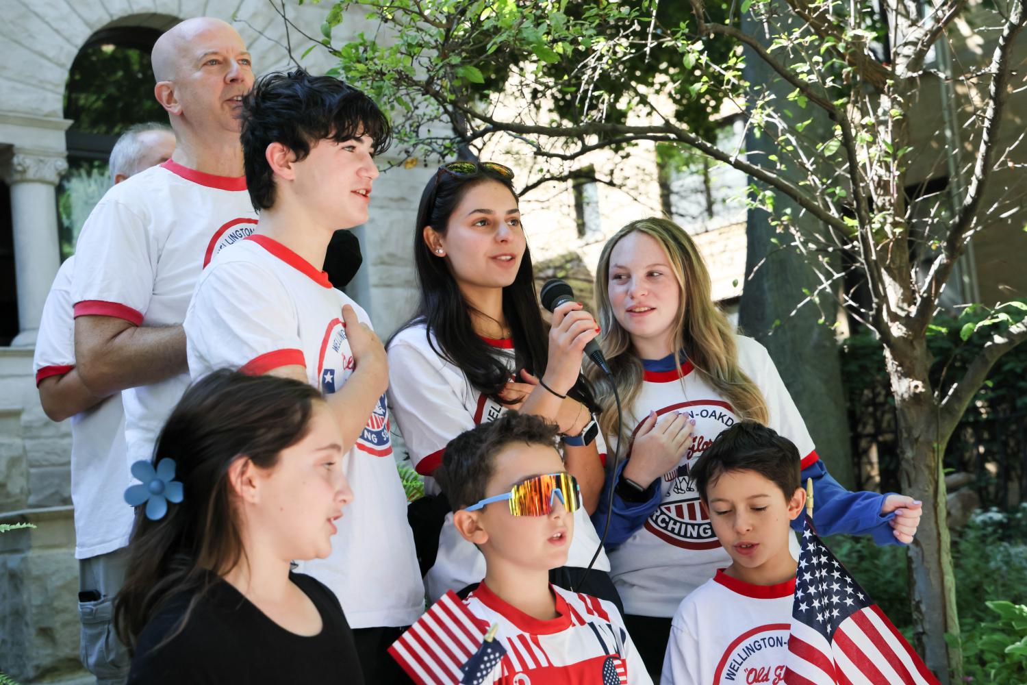 Sophie leads the Pledge of Allegiance before the start of a Labor Day Parade in Chicago, September 2, 2024.