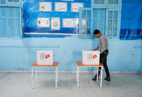A man fills out his ballot