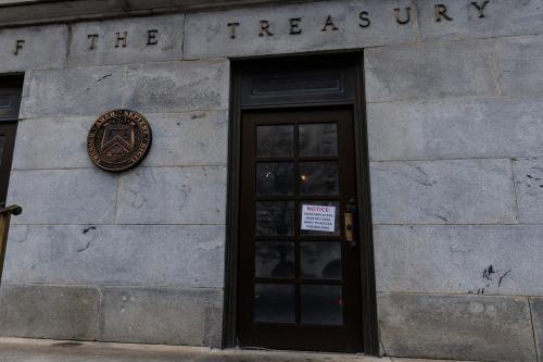 A sign alleging Department of Government Efficiency (DOGE) employees cannot legally enter the Treasury Department is seen on the outside doors of the Treasury Building in Washington, D.C. on Saturday, February 8, 2025. A federal judge ruled to restrict the Elon Musk-run DOGE program's access to the Treasury's trillion dollar payment processing systems.