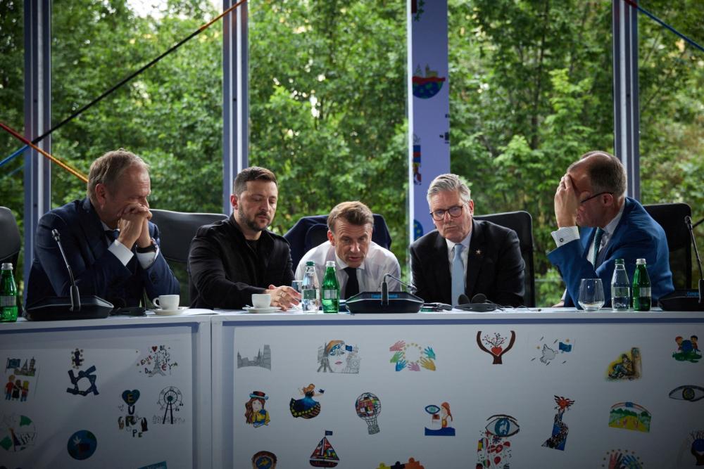 Ukraine's President Volodymyr Zelenskiy, Britain's Prime Minister Keir Starmer, France's President Emmanuel Macron, German Chancellor Friedrich Merz and Polish Prime Minister Donald Tusk speak with U.S. President Donald Trump via phone during the European Political Community Summit in Tirana, Albania May 16, 2025.