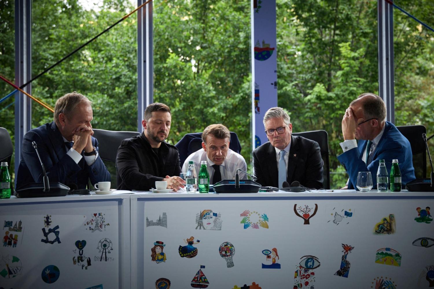 Ukraine's President Volodymyr Zelenskiy, Britain's Prime Minister Keir Starmer, France's President Emmanuel Macron, German Chancellor Friedrich Merz and Polish Prime Minister Donald Tusk speak with U.S. President Donald Trump via phone during the European Political Community Summit in Tirana, Albania May 16, 2025.