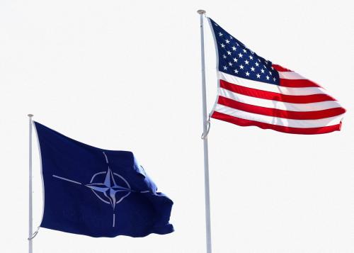 The flags of NATO and the U.S. flutter at NATO headquarters in Brussels, Belgium, April 2, 2025.