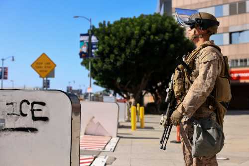 A U.S. Marine stands guard outside the Edward R. Roybal Federal Building amid federal immigration sweeps, in Los Angeles, California, U.S., June 18, 2025.
